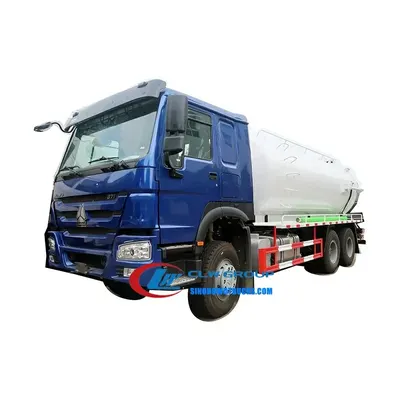 Side view of the HOWO vacuum truck with wire-strengthened hose and control panel on the cab side
