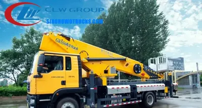 Side view of the HOWO manlift truck showing the 7-section telescopic arm and hydraulic outriggers deployed