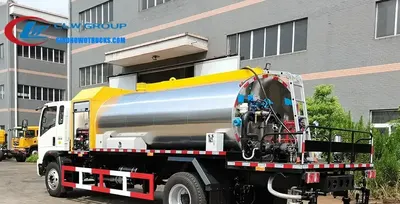 Side view of the asphalt truck showing adjustable spray width and nozzle array