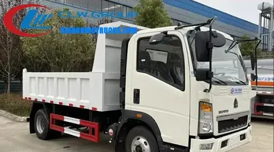 Side view of the HOWO 5 ton gravel truck showing the 7.00R16 tires and electrically hydraulic control system
