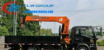 Side view of the HOWO truck-mounted crane showing the cargo box and crane boom structure