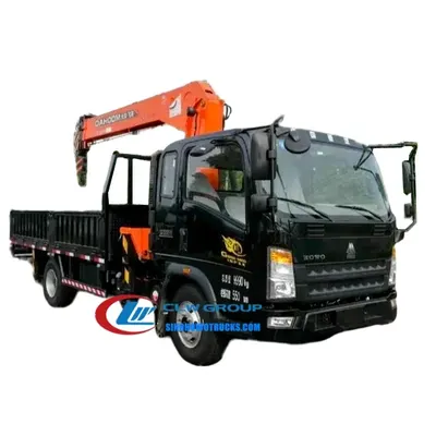 Rear view of the HOWO loader crane with the crane control panel and hydraulic lines visible