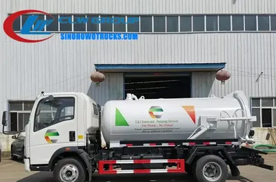 Rear view of the vacuum pump and discharge nozzle on the HOWO sewage removal truck