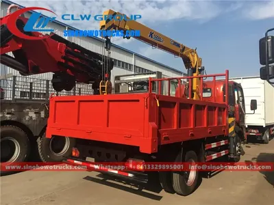 Rear view of the HOWO truck crane showing the 360 degree rotating boom and cargo box