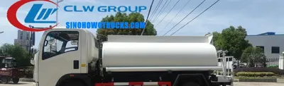 Sinotruk HOWO 5000L food grade stainless steel drinking water tanker in service with rear spray system active