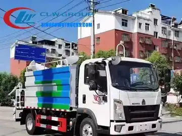 Sinotruk HOWO 5000 litre dust control truck in service on a construction site with rear spray system active