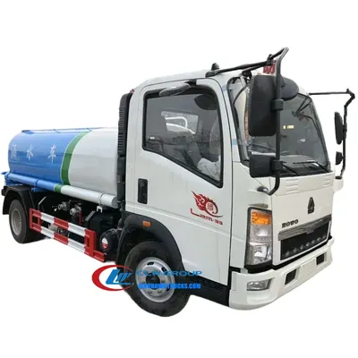 Side view of the HOWO water lorry with front and side spray nozzles in operation
