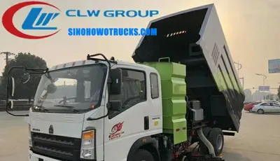 Front view of the HOWO vacuum sweeper with water spray nozzles and sweeping brush
