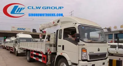 Side view of the HOWO crane lorry showing the 6x4 chassis, 9.00R20 tires, and high-strength steel body