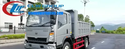 Sinotruk HOWO 6 cube tipper truck in a construction site with middle lifting hydraulic system raised