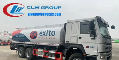 Side view of the HOWO diesel tanker truck showing aluminum alloy manholes and discharge valves