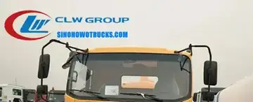 Sinotruk HOWO 6000 litre manure suction truck in Kenya with hydraulic rear door open and suction pipe extended