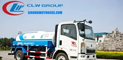Side view of the HOWO water tanker showing front and side spray systems and tank structure