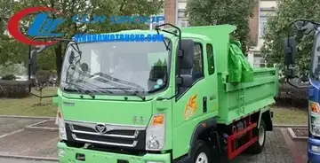 Sinotruk HOWO 6m3 commercial dump truck in red with middle tipping hydraulic system in a rural construction site