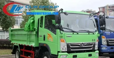 Rear view of the HOWO dump truck with the hydraulic lift system engaged and the body raised