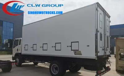 Side view of the HOWO chicks transport truck showing FRP cargo box and exhaust vents