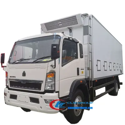 Rear view of the HOWO baby chick transport truck with cooling unit and exhaust fan
