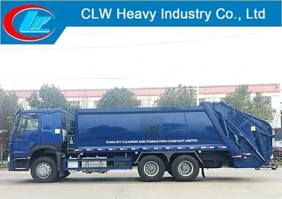 Sinotruk HOWO 6x4 compactor dustbin lorry in urban waste collection setting with open hopper and compacted refuse