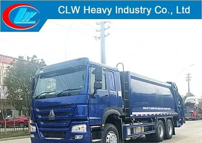 Side view of the HOWO compactor truck showing the high-strength T420 steel body and hydraulic compaction mechanism