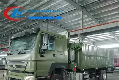 Rear view of the HOWO crane truck with the boom extended and the integral winch visible