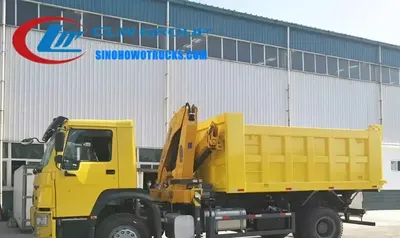 Sinotruk HOWO 7.5 tonne tipper truck with crane in construction site environment, boom extended and cargo box raised