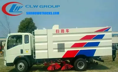 Side view of the HOWO road sweeper showing stainless steel dustbin and water tank