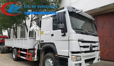 Side view of the HOWO crane truck showing the 360 degree slewing mechanism and high-strength cargo body