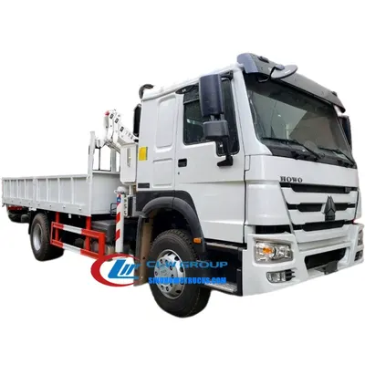 Rear view of the HOWO crane truck with the boom fully extended and lifting a heavy load