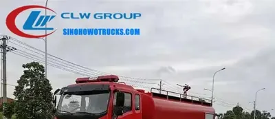 Side view of the HOWO fire tender with open aluminium roller shutter lockers