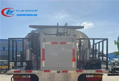 Rear platform of the bitumen spreader with computer control panel and nozzle array