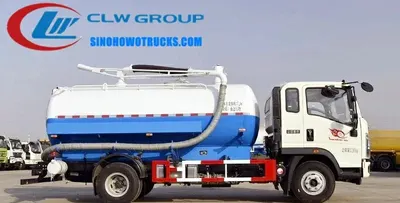 Front view of the HOWO septic pump truck showing the cab, suction hose, and control panel