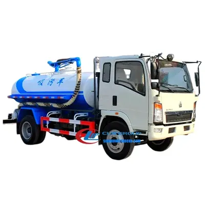 Side view of the HOWO cesspool truck with open manhole and vacuum pump access