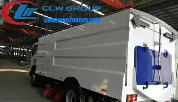 Sinotruk HOWO 8m3 street sweeper vacuum truck in urban setting with front brushes and rear vacuum inlet