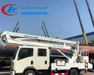 Side view of the HOWO aerial lift truck showing double cabin and work basket with 90 degree rotation