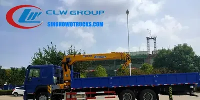 Sinotruk HOWO 6x4 heavy duty truck crane with telescopic boom in operation on a construction site