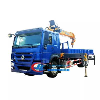 Side view of the HOWO truck crane showing the high-strength steel frame and crane subframe