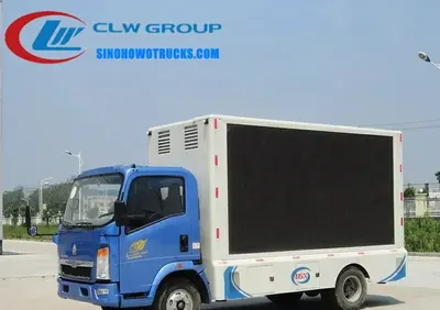 Side view of the HOWO LED advertising truck showing the 3840 x 1728 mm full-color screen and lifting mechanism