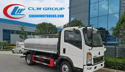Side view of the HOWO mini milk tanker showing four compartments and stainless steel pipelines