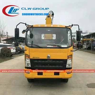 Side view of the small crane truck showing the telescopic boom and compact hinge point design