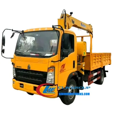 Rear view of the truck with the crane in extended position and cargo box loaded with pipes