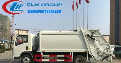 Rear view of the HOWO compactor truck showing hydraulic system and sealed waste tank
