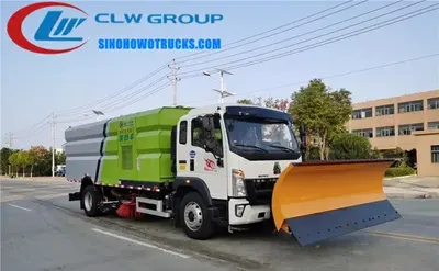 Front view of the HOWO sweeper showing sweeping brooms, sprayers, and air blower