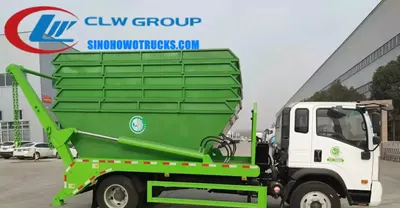 Sinotruk mini skip loader truck in urban waste collection setting with swing arm lifting a 8cbm skip container