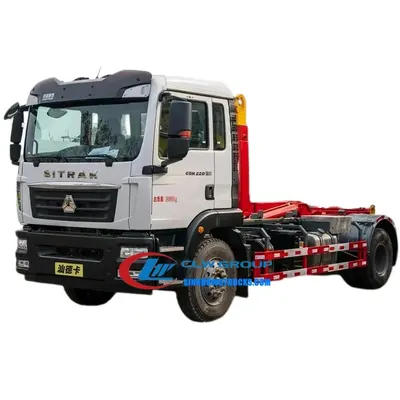 Rear view of the SINOTRUK SITRAK roll off truck showing the hook loader system and container mounting points