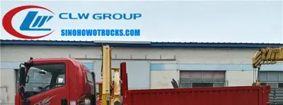 Truck carrier truck with crane mounted on the rear, showing the cargo box and lifting arm