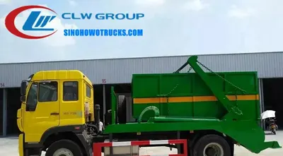 Sinotruk Steyr 10 ton skip loader truck with 10CBM carbon steel container and swing arm system in operation