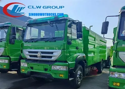 Side view of the HOWO street sweeper showing stainless steel tank and water spray system