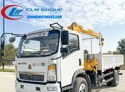 Sinotruk Wangpai small crane truck with telescopic boom in operation on a construction site in Kazakhstan