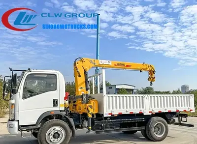 Side view of the small truck-mounted crane showing the 360-degree rotating boom and cargo box