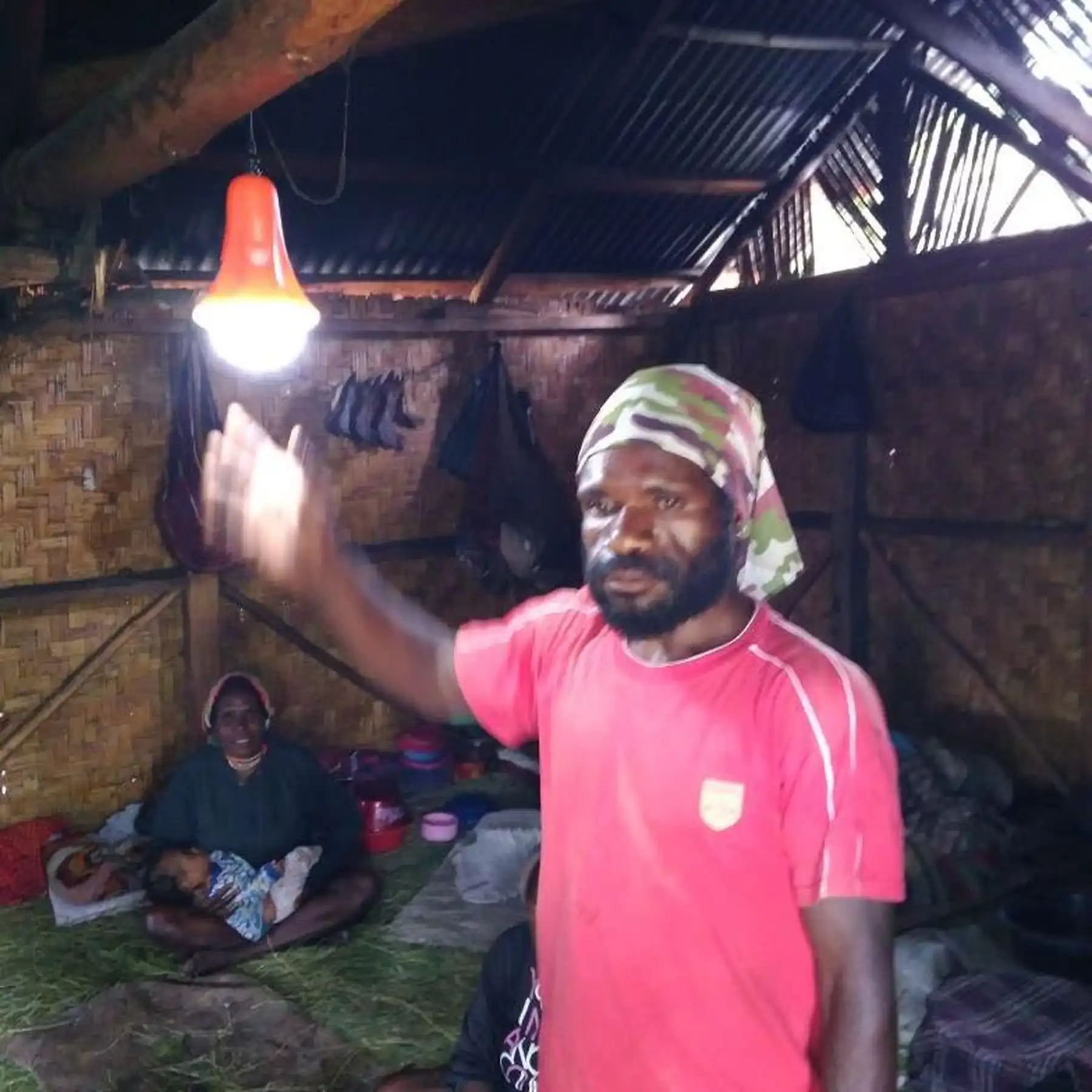 A Sinoware solar lantern in use in an off-grid household at night